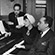 Etta Moten Barnett (center), Arna Bontemps (l), and Langston Hughes (r) at the piano, n.d.
