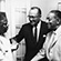 Earl B. Dickerson, A. W. Williams (President of Unity Mutual Life), and Julius Momo Udochi (Nigerian Ambassador to the United States), at the Dickerson home, 5027 S. Drexel Ave., Chicago, c. August 1961. Supreme Liberty Life Insurance Co. was a center of black business at mid-century, and among the stops for Udochi, the first ambassador to the United States for the newly-independent Nigeria, on his tour of Chicago. In addition to showing him the offices of Supreme and Ebony-Jet publishing, Dickerson hosted a 'stag dinner' in Udochi's honor, inviting many representatives of Chicago's black business community.